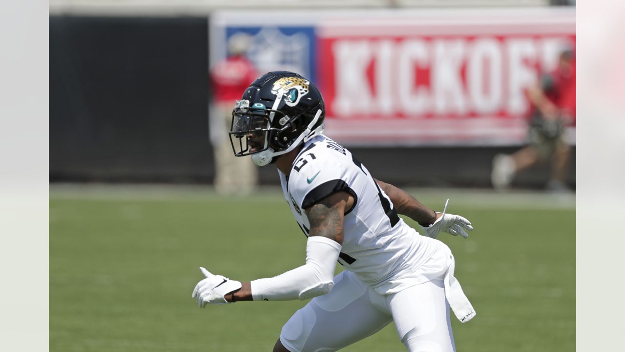 JACKSONVILLE, FL - JANUARY 14: Jacksonville Jaguars cornerback Tre Herndon  (37) runs with the ball during the game between the Los Angeles Chargers  and the Jacksonville Jaguars on January 14, 2023 at