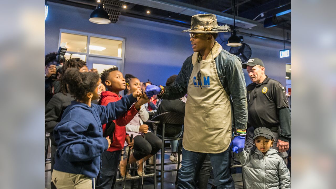 Cam Newton holds annual 'Thanksgiving Jam' for 1,200 children and their  families 