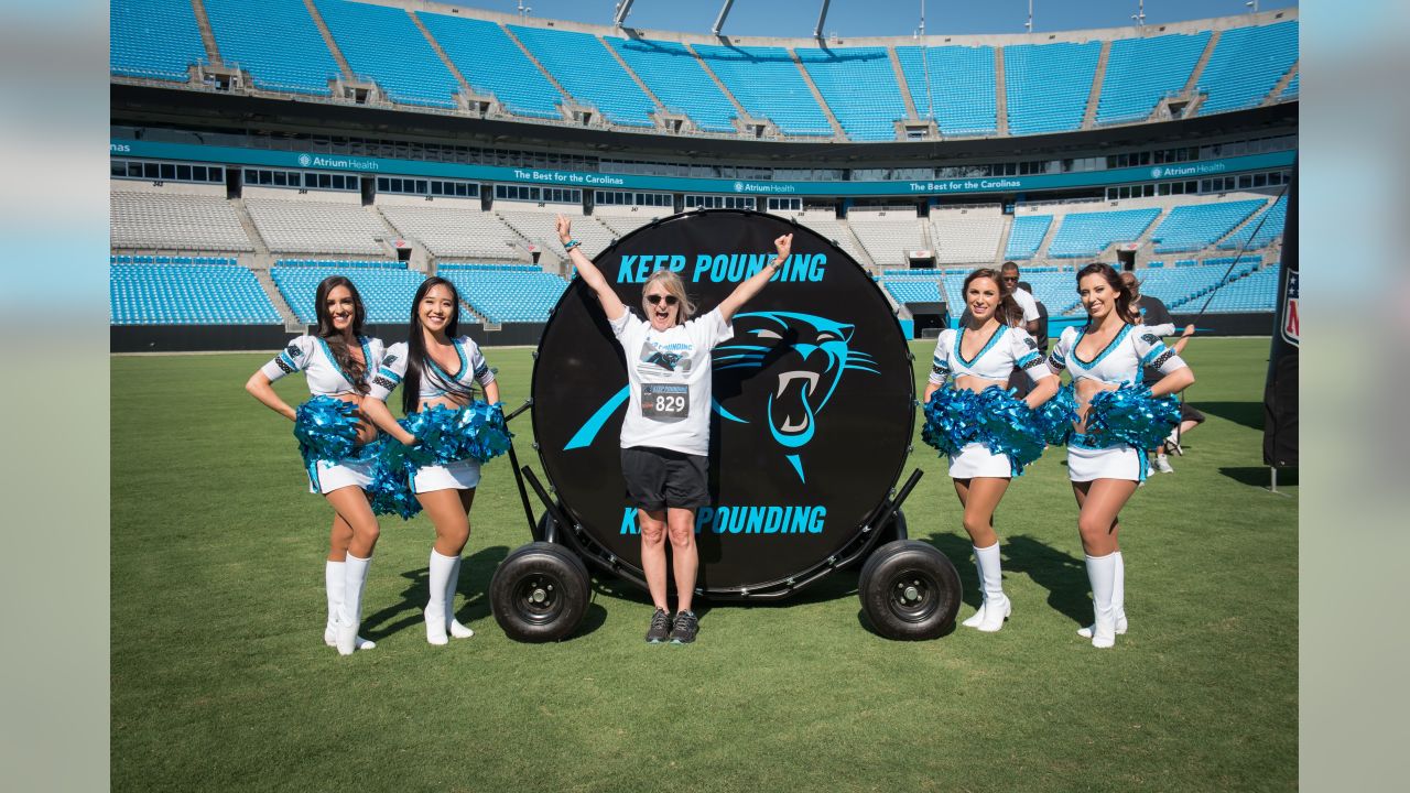 A young Carolina Panthers fan cheers at the Panthers Pride Rally