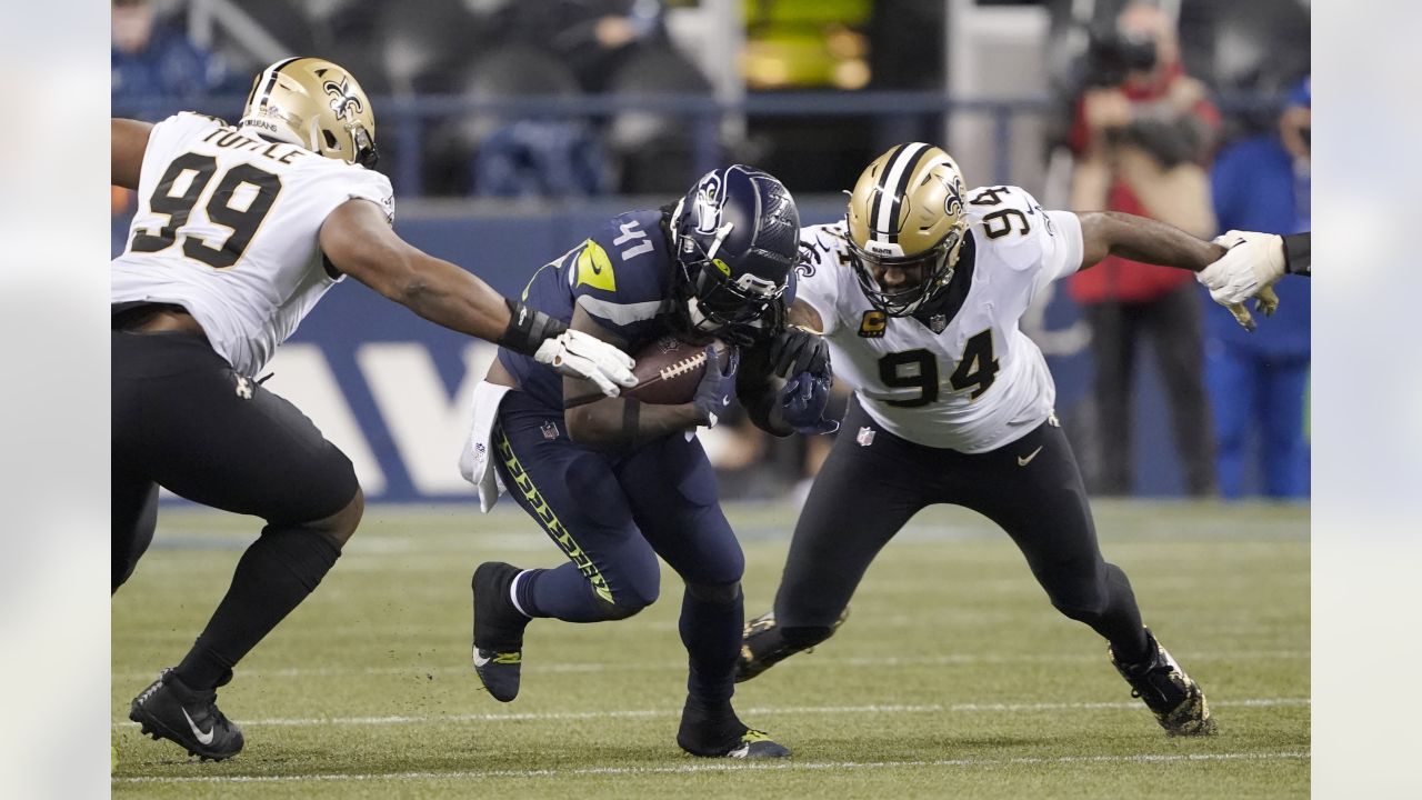 New Orleans Saints defensive end Cameron Jordan (94) celebrates after a  play during an NFL football game against the Seattle Seahawks, Sunday, Oct.  9, 2022, in New Orleans. (AP Photo/Tyler Kaufman Stock