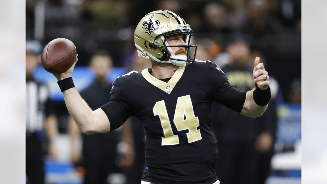 New Orleans Saints quarterback Andy Dalton (14) warms up an NFL