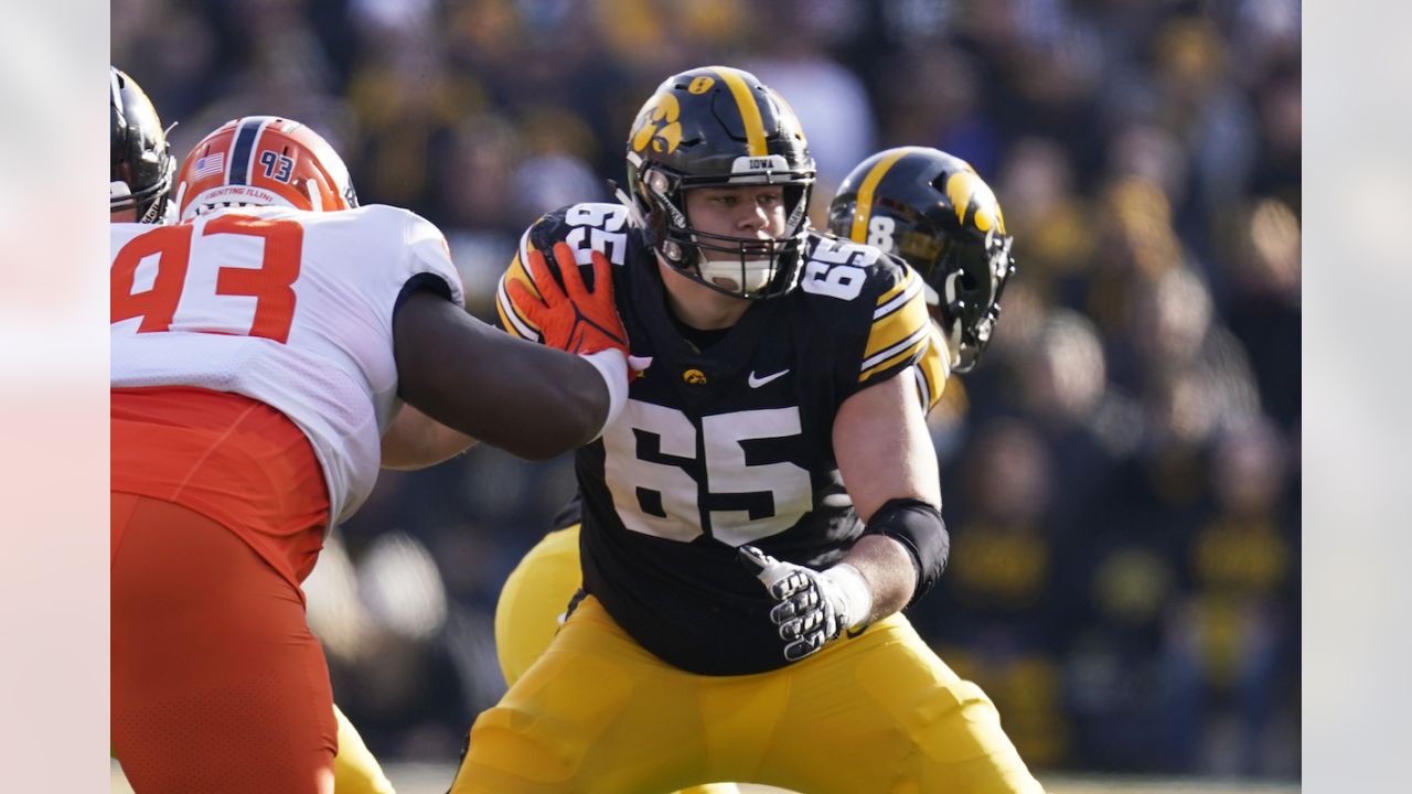 FILE - Iowa offensive lineman Tyler Linderbaum (65) looks to make a block  during the first half of an NCAA college football game against Indiana in  Iowa City, Iowa, Saturday, Sept. 4