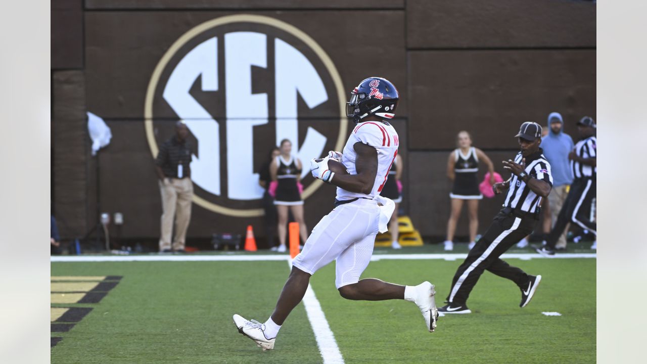 DK Metcalf Ole Miss Rebels Unsigned White Jersey Running Photograph