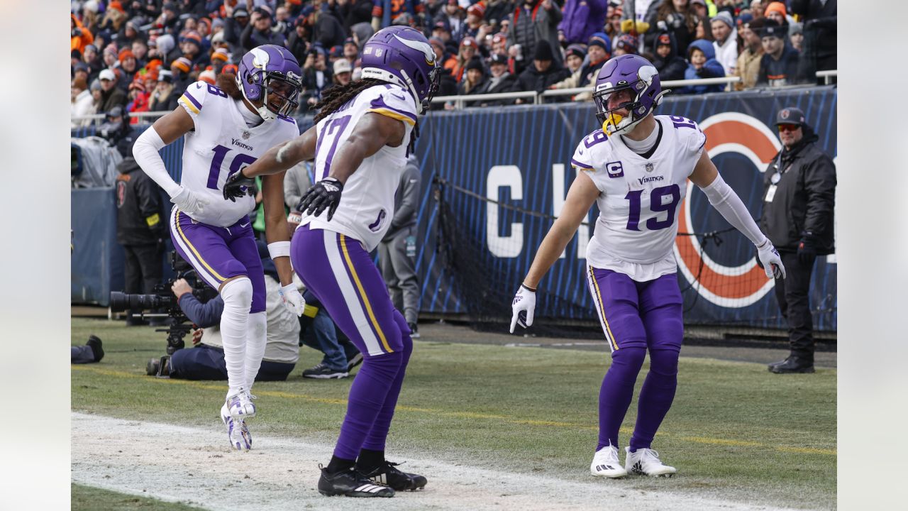 Minnesota Vikings wide receivers Justin Jefferson (18) and Adam Thielen  (19) celebrate after Jefferson scored a touchdown against the New York  Jets, during the second half of an NFL football game Sunday