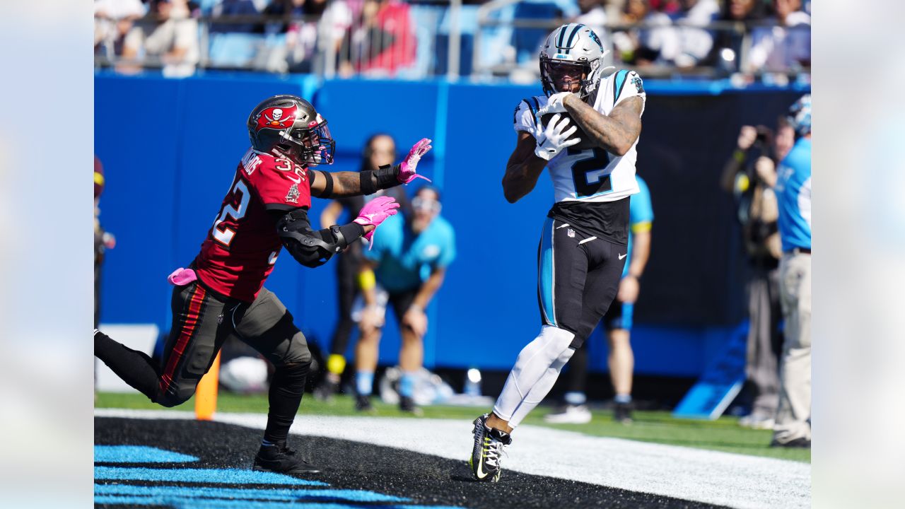 Tampa Bay Buccaneers vs. Carolina Panthers. NFL Game. American Football  League match. Silhouette of professional player celebrate touch down.  Screen in background. Stock Photo