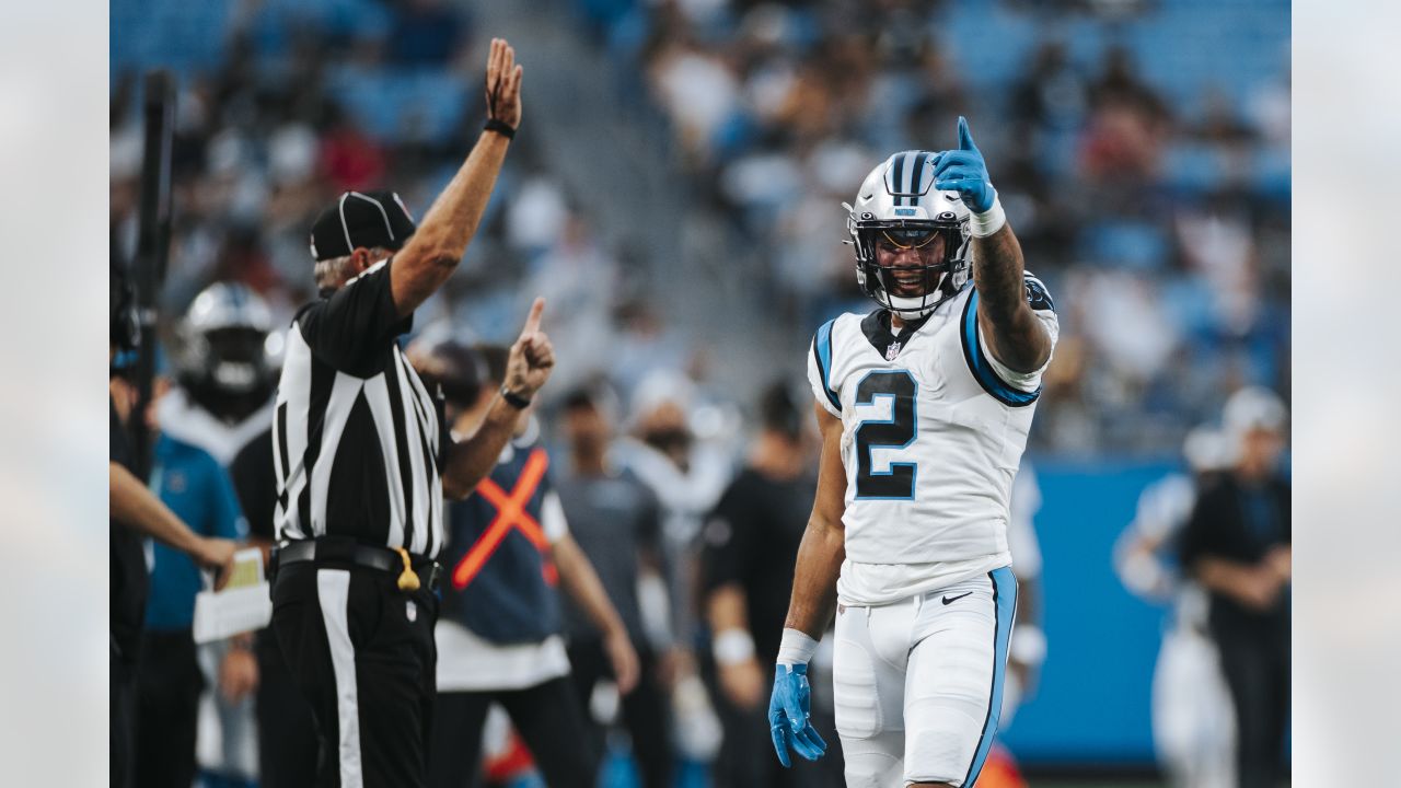 Carolina Panthers kicker Ryan Santoso wears a 9/11 FDNY hat during