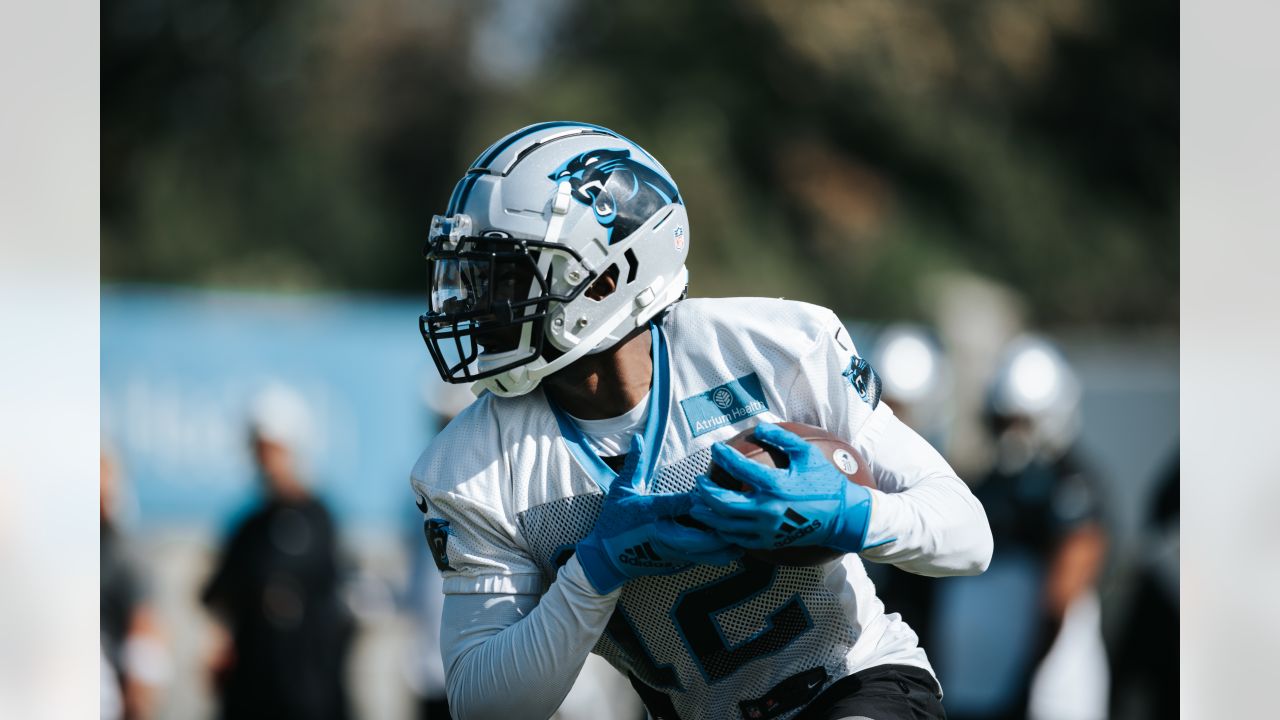 Carolina Panthers guard Michael Jordan stands on the field at the