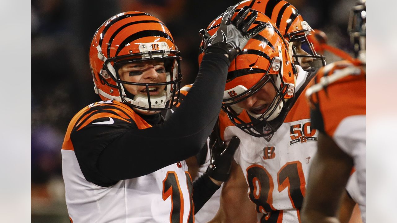 Cincinnati Bengals quarterback Andy Dalton (14) walks off the