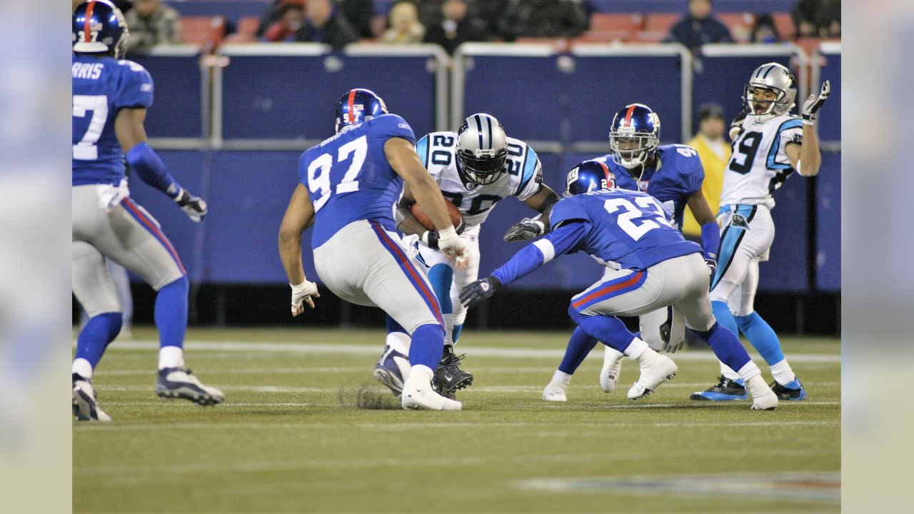 New York Giants Eli Manning scrambles away from pressure in the 3rd quarter  at Giants Stadium in East Rutherford, New Jersey on December 3, 2006. The  Dallas Cowboys defeated the New York