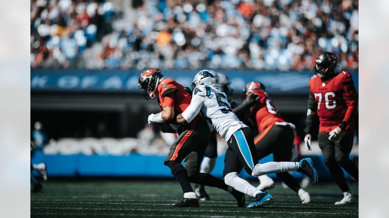 Tampa Bay Buccaneers vs. Carolina Panthers. NFL Game. American Football  League match. Silhouette of professional player celebrate touch down.  Screen in background. Stock Photo