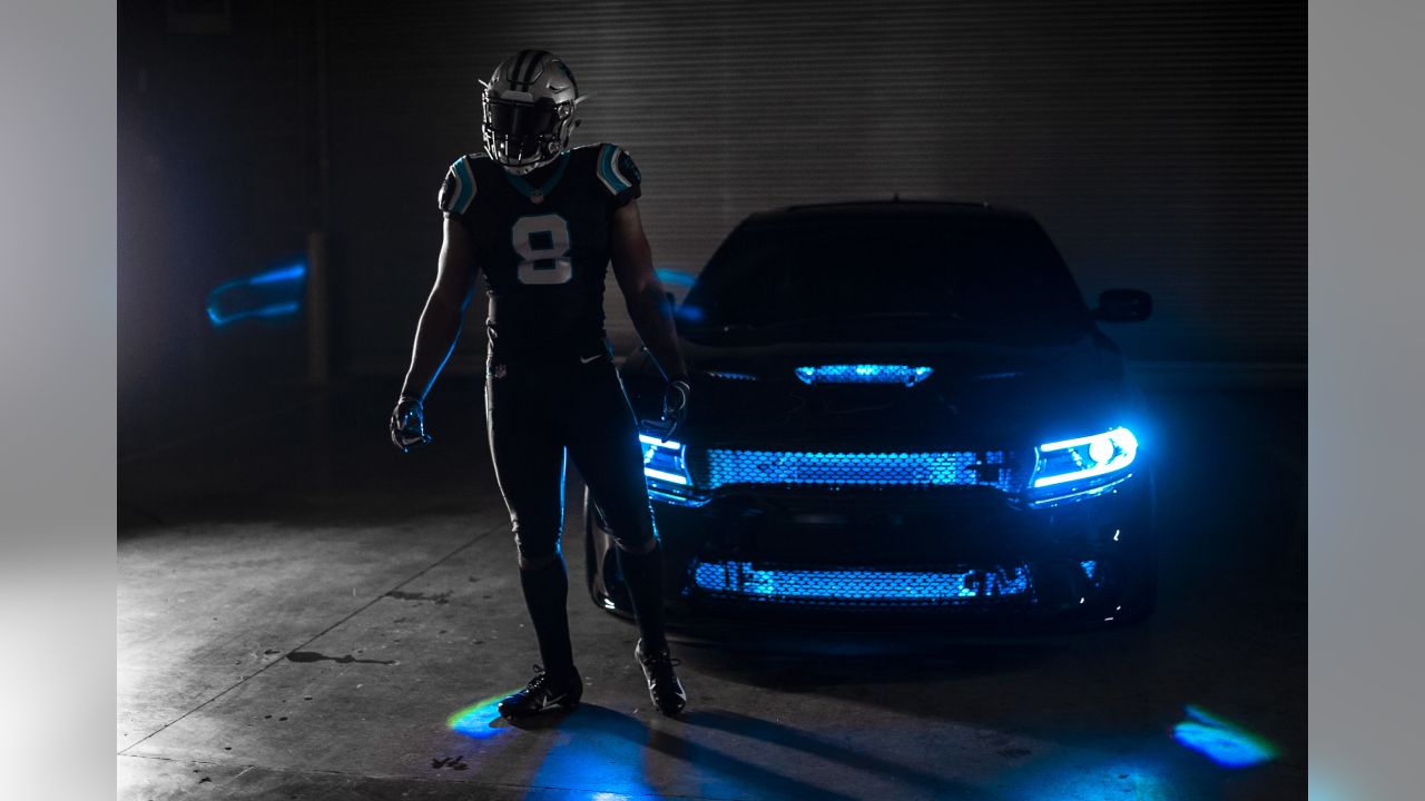 Cam Newton of the Carolina Panthers wearing black on black