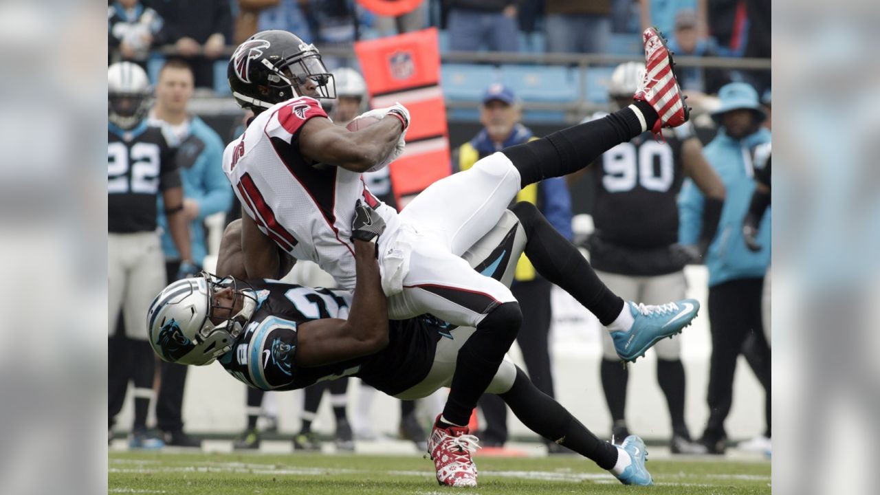 Carolina Panthers' Greg Olsen (88) celebrates with Cam Newton (1) after  Olsen passed 1,000 yards receiving in the first half of an NFL football  game against the Atlanta Falcons in Charlotte, N.C., …