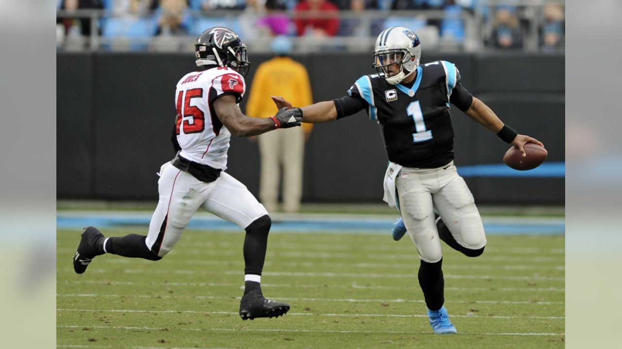 Carolina Panthers safety Tre Boston (33) celebrates with quarterback Cam  Newton (1) after his interception and 84-yard touchdown run against the  Atlanta Falcons during the second half of their NFL game at