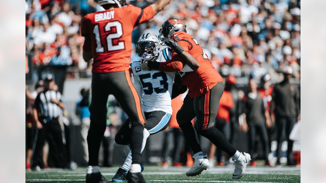 Tampa Bay Buccaneers vs. Carolina Panthers. NFL Game. American Football  League match. Silhouette of professional player celebrate touch down.  Screen in background. Stock Photo