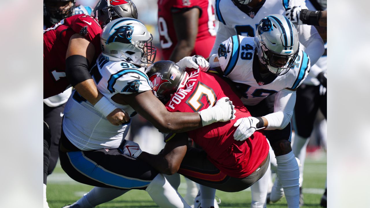 Tampa Bay Buccaneers vs. Carolina Panthers. NFL Game. American Football  League match. Silhouette of professional player celebrate touch down.  Screen in background. Stock Photo