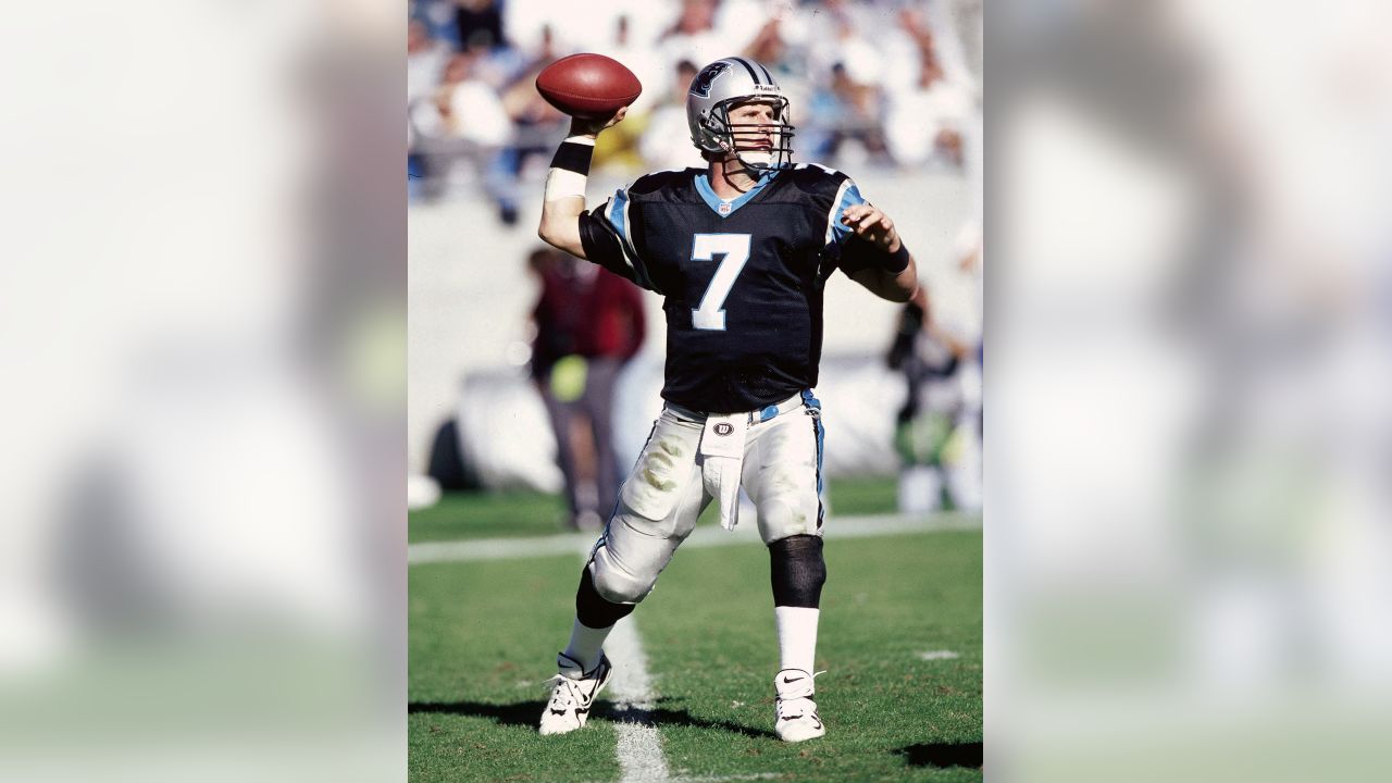 Quarterback Steve Beuerlein of the Carolina Panthers scrambles