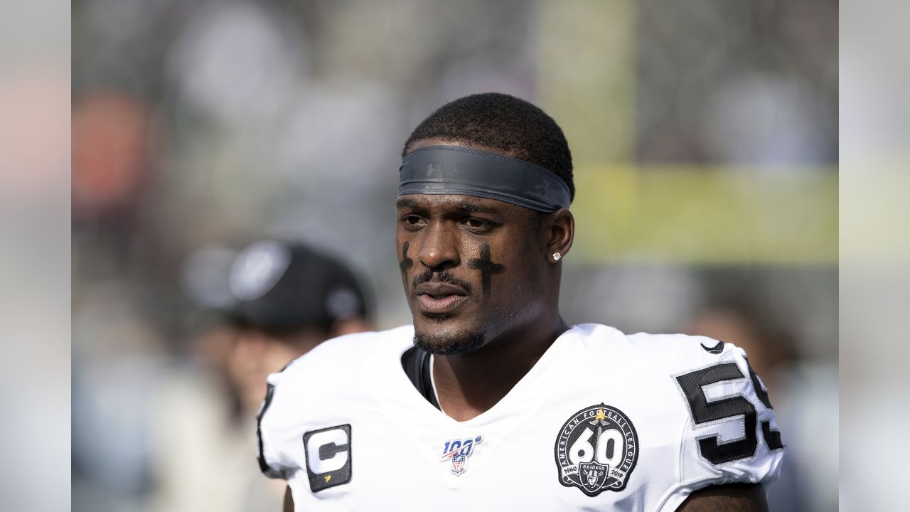 NFL player Tahir Whitehead gestures as he coaches a young team during the  final tournament for the UK's NFL Flag Championship, featuring qualifying  teams from around the country, at the Tottenham Hotspur