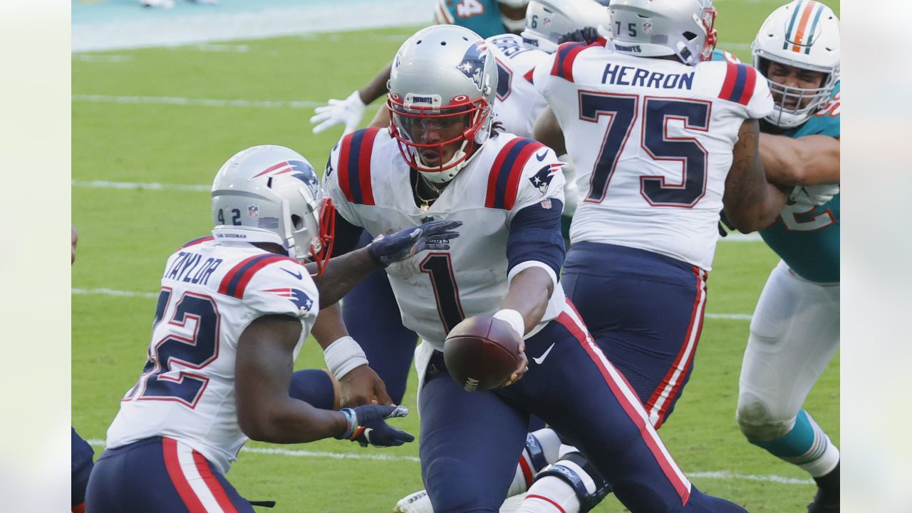 Miami Dolphins running back Lynn Bowden (15) runs after a catch against the  New England Patriot …