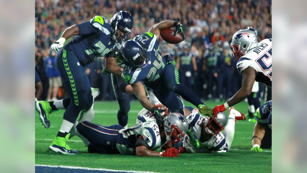 New England Patriots Rob Ninkovich (50) and WR Julian Edelman (R) celebrate  a Malcolm Butler interception of a Seattle Seahawks pass with 26 seconds  remaining in Super Bowl XLIX at University of