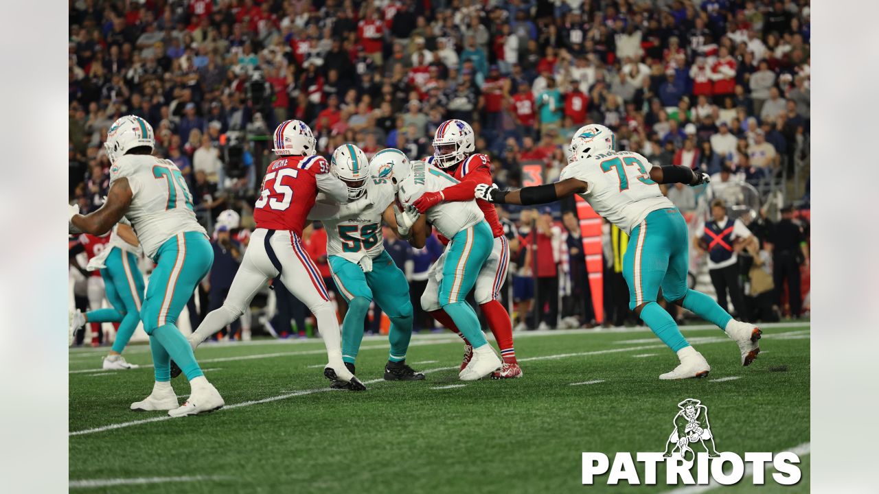 Miami Dolphins vs. New England Patriots. Fans support on NFL Game.  Silhouette of supporters, big screen with two rivals in background Stock  Photo - Alamy