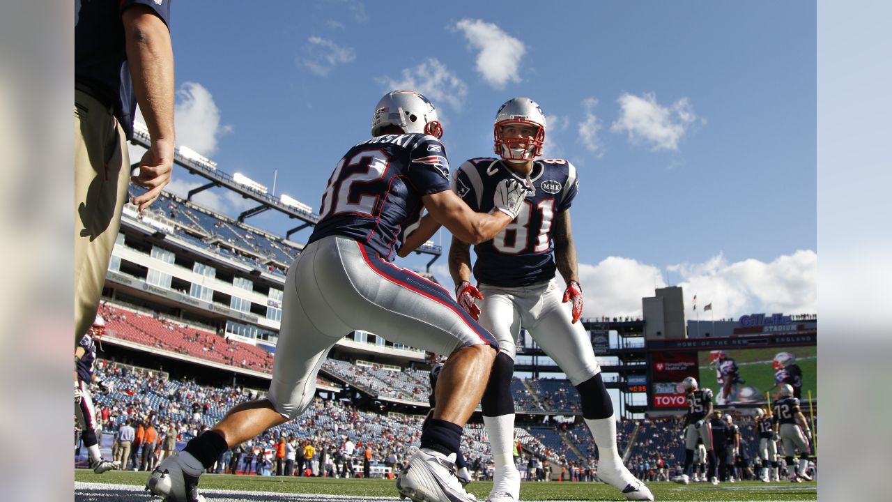 New England Patriots quarterback Tom Brady (12) shakes hands teammate tight  end Aaron Hernandez (85) after Hernandez scored on a ten yard reception  against the Green Bay Packers at Gillette Stadium in