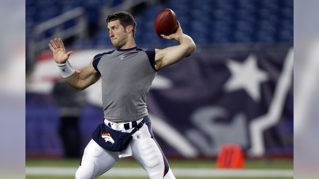 Quarterback Tim Tebow (15) celebrates a score during an NFL game against  the New England Patriots – Denver Broncos History