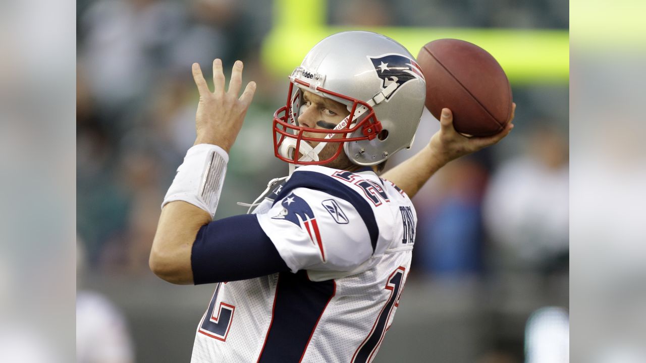 New England Patriots' Tom Brady (12) and Brian Hoyer (2) warm up before the  NFL Super