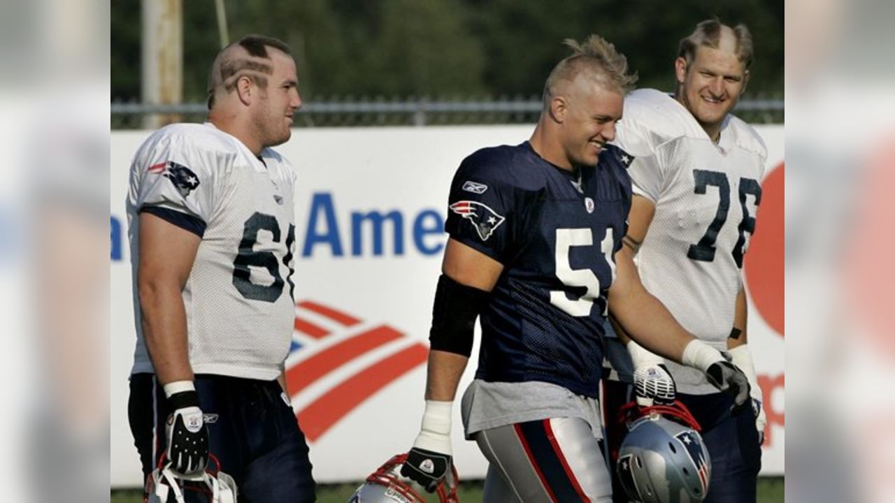 New England Patriots wide receiver Wes Welker (83) talks with Patriots  running back Kevin Faulk (33) during the first session of training camp at  their football facility in Foxborough, Mass., Thursday morning