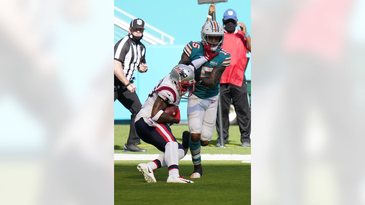 Miami Dolphins running back Lynn Bowden (15) runs after a catch against the  New England Patriot …