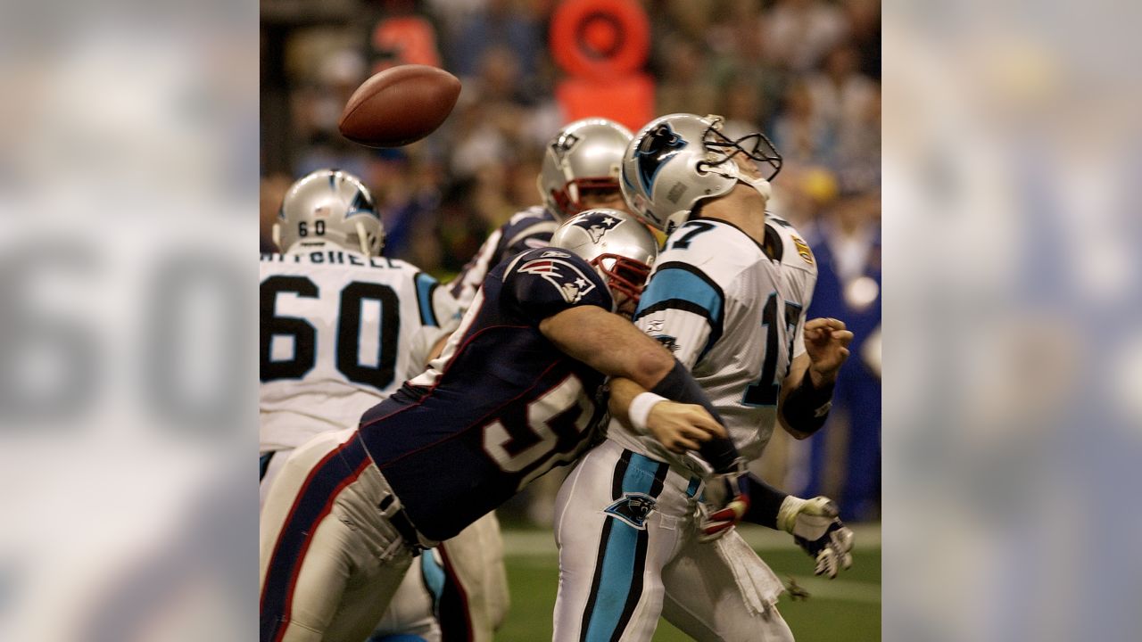 Patriot's quarterback Tom Brady (12) passes the time during pregame at  Super Bowl XXXVIII on February 1, 2004. The New England Patriots face the  Carolina Panthers at Reliant Stadium in Houston, Texas. (