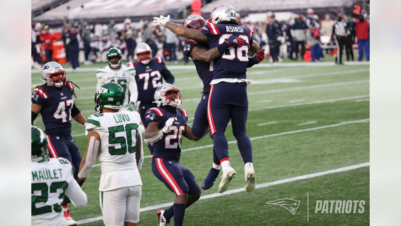 New England Patriots quarterback Cam Newton (1) celebrates with offensive  lineman James Ferentz (66)