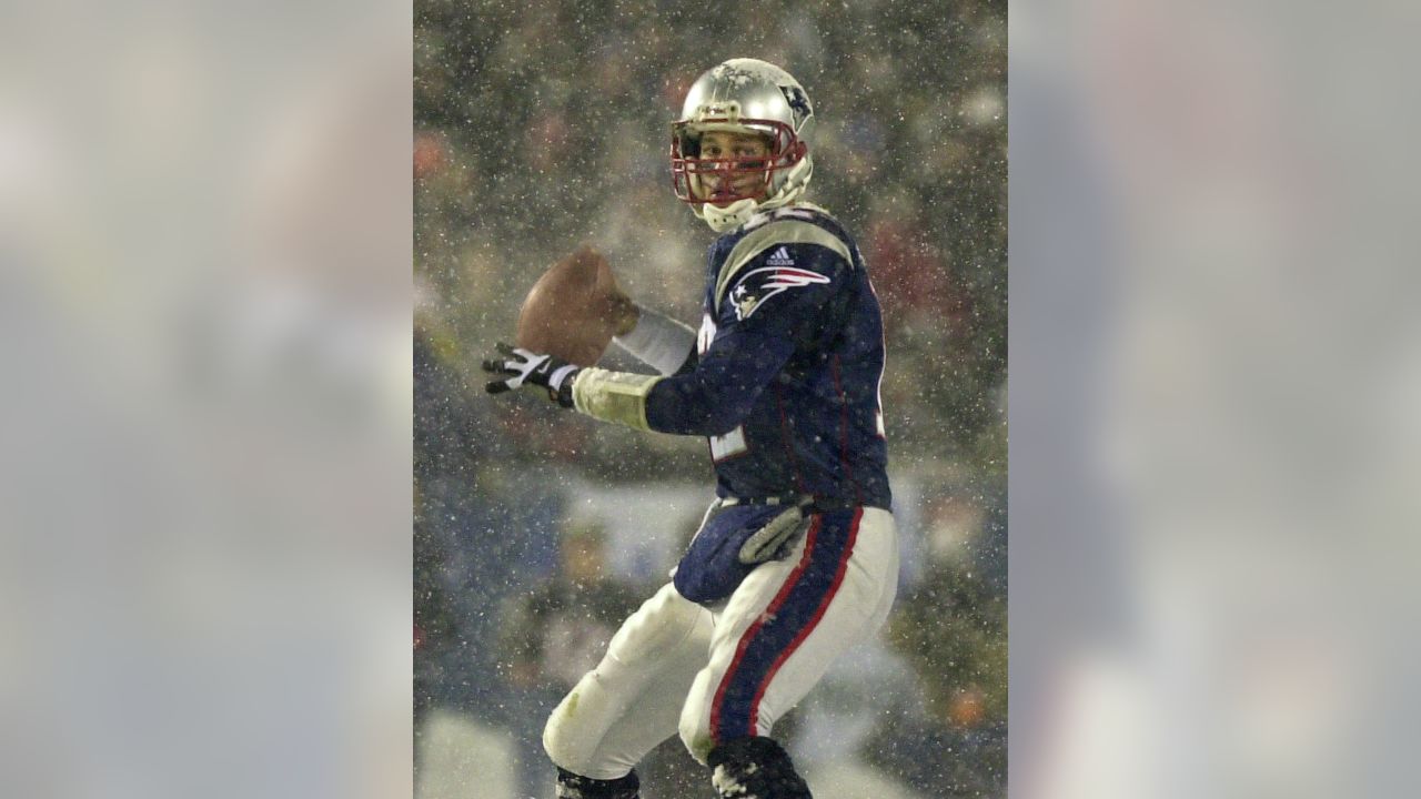 Jan 19, 2002; Foxboro, MA, USA; New England Patriots quarterback Tom Brady,  #12, releases the ball in the 4th qt. against the Oakland Raiders during  their AFC playoff game on Saturday, January