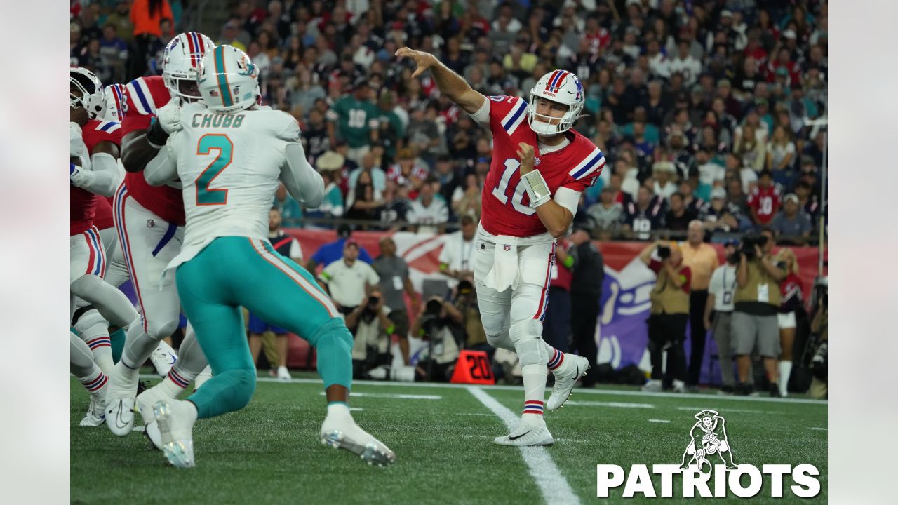 Miami Dolphins vs. New England Patriots. Fans support on NFL Game.  Silhouette of supporters, big screen with two rivals in background Stock  Photo - Alamy