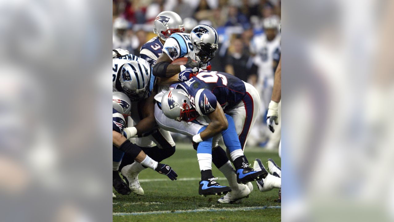 Patriot's kicker Adam Vinatieri (4) celebrates with Ken Walter (13) and  Christian Fauria (88) the game winning field goal of Super Bowl XXXVIII on  February 1, 2004. The New England Patriots face