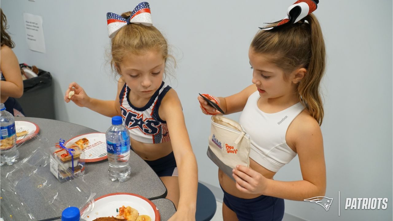 Patriots Cheerleaders participate in Papa Gino's Pizza and Pom Poms