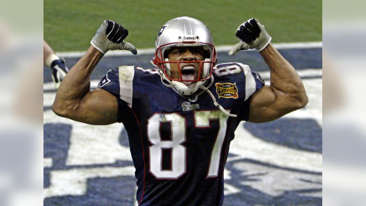 Patriot's kicker Adam Vinatieri (4) celebrates with Ken Walter (13) and  Christian Fauria (88) the game winning field goal of Super Bowl XXXVIII on  February 1, 2004. The New England Patriots face