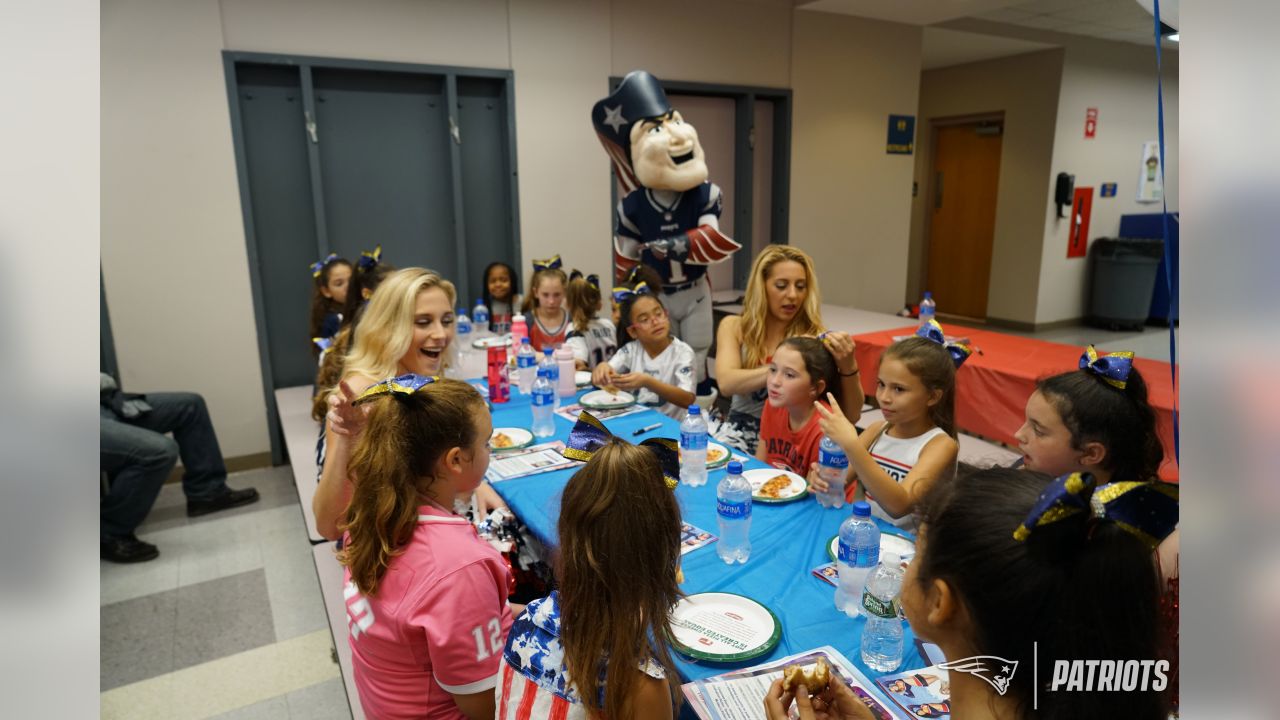 Patriots Cheerleaders participate in Papa Gino's Pizza and Pom Poms