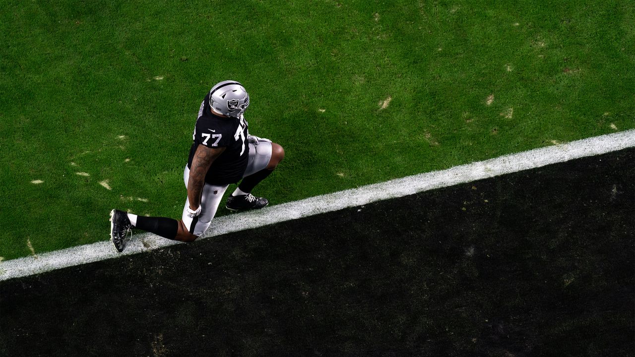 Las Vegas Raiders offensive tackle Trent Brown (77) warms up on the field  before an NFL footbal …