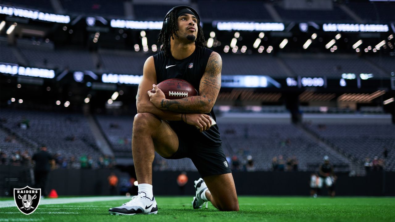 Raiders safety Trevon Moehrig (25) makes a leaping catch during a special  training camp practic …