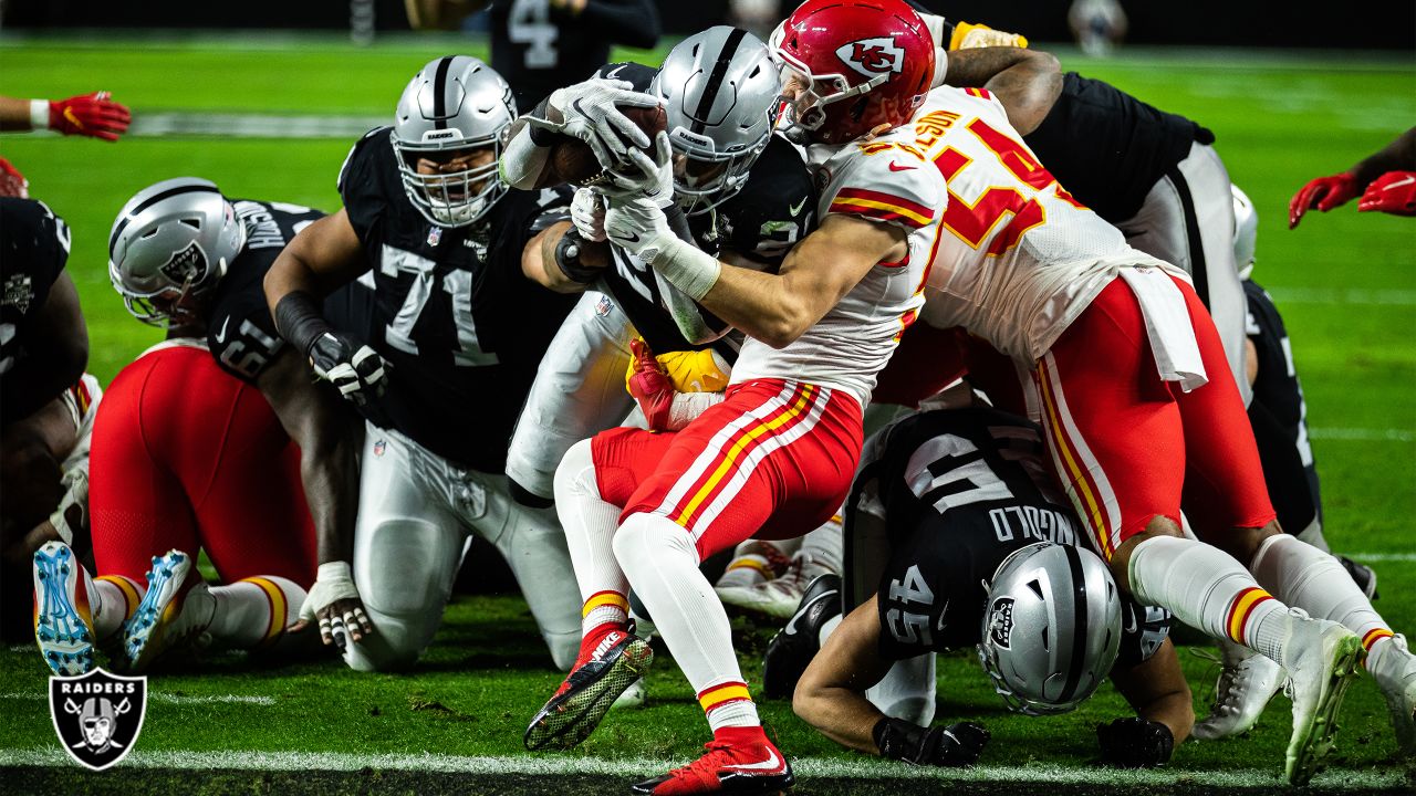 Las Vegas Raiders running back Josh Jacobs (28, left) jokes around with  head coach Jon Gruden d …