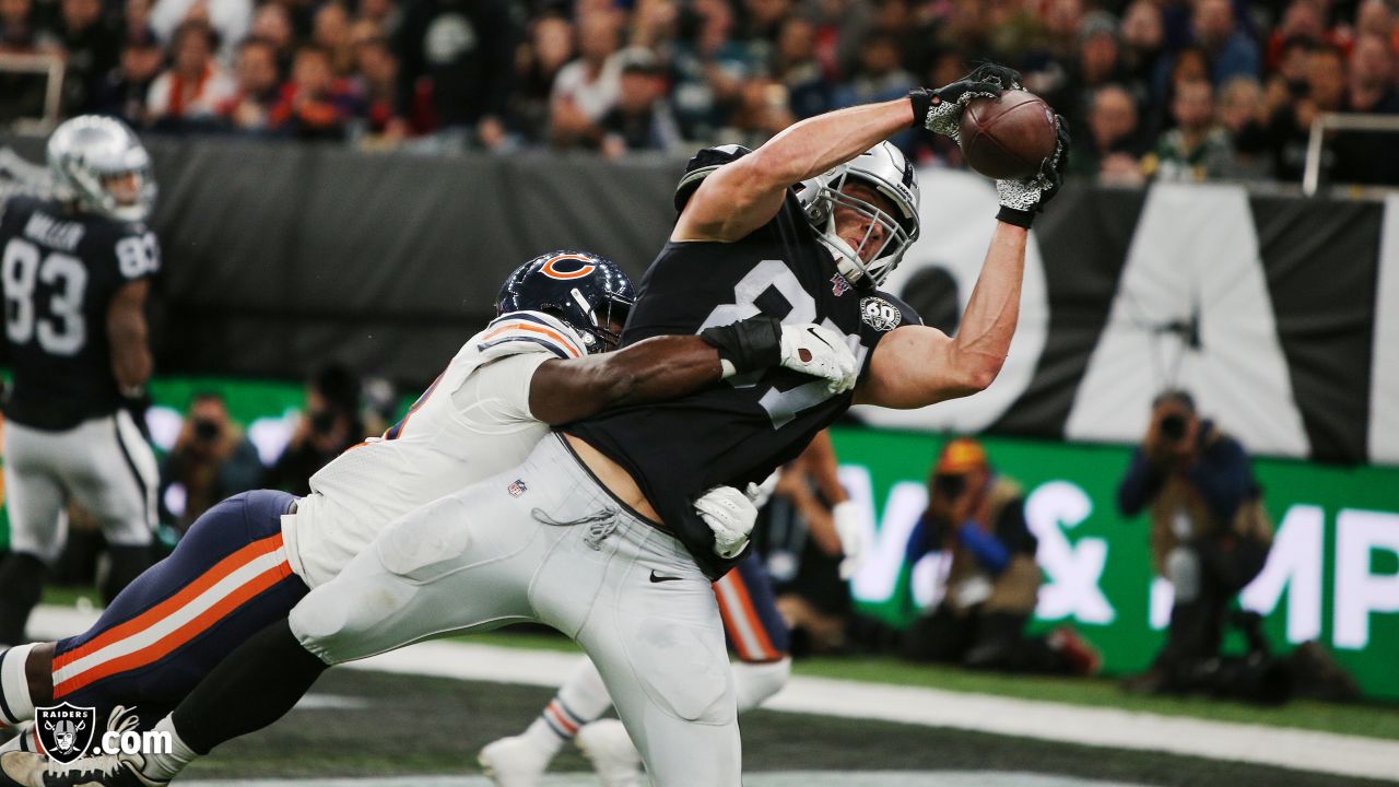 Raiders tight end Foster Moreau (87) prepares to spike the