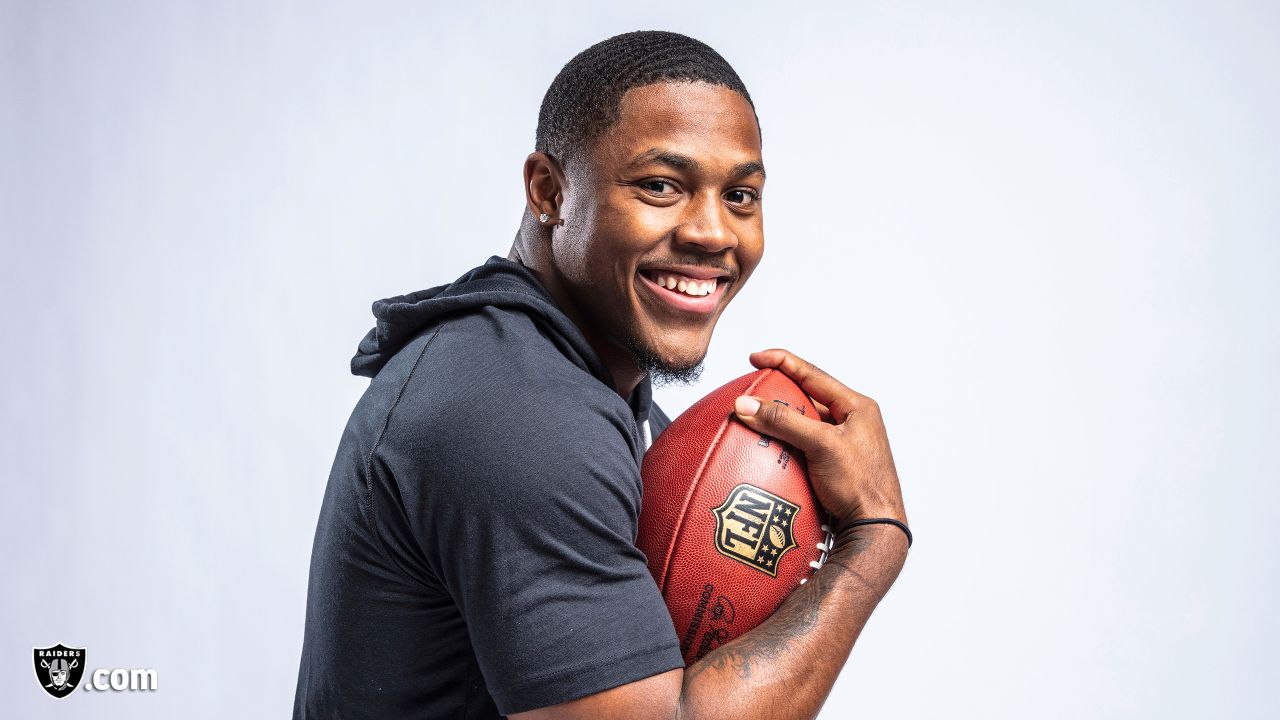 Photo: Josh Jacobs receives a jersey from NFL Commissioner Roger