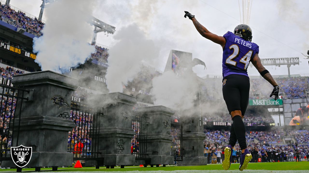 Baltimore Ravens cornerback Marcus Peters (24) reacts to the snap