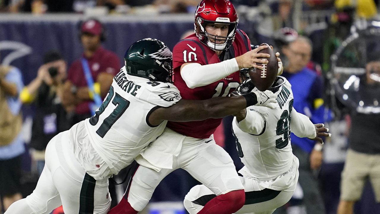 Las Vegas Raiders running back Josh Jacobs (28) carries against Los Angeles  Chargers linebacker Drue Tranquill (49) during the first half of an NFL  football game, Sunday, Dec. 4, 2022, in Las