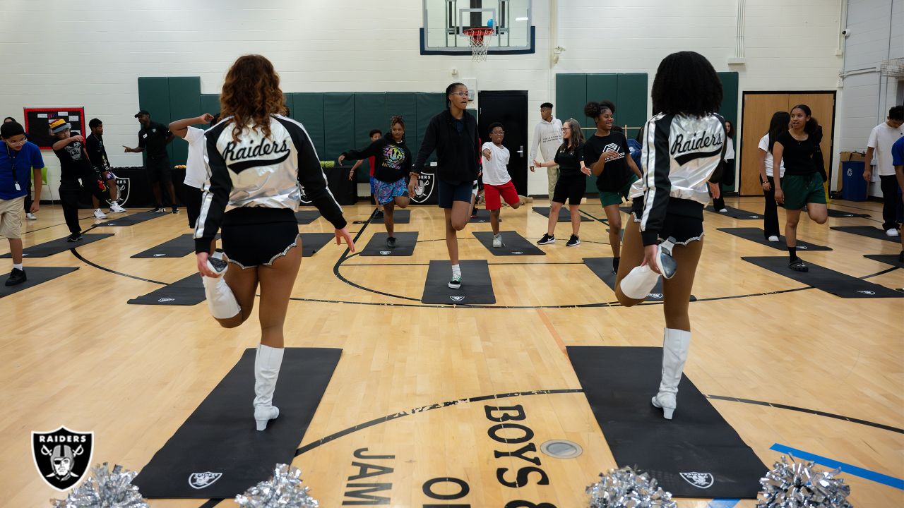 Raiderettes practice in their Halloween costumes