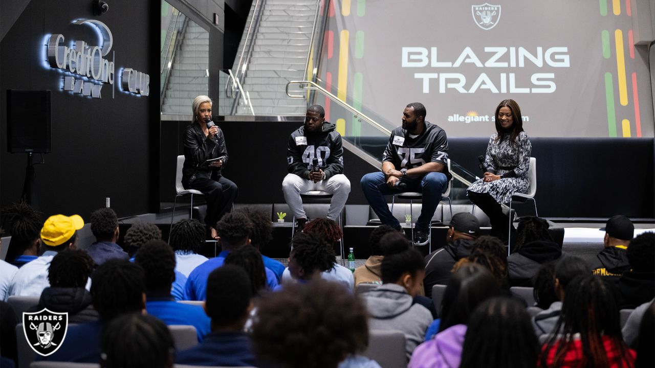 A man poses inside the Raider Image team store at Allegiant