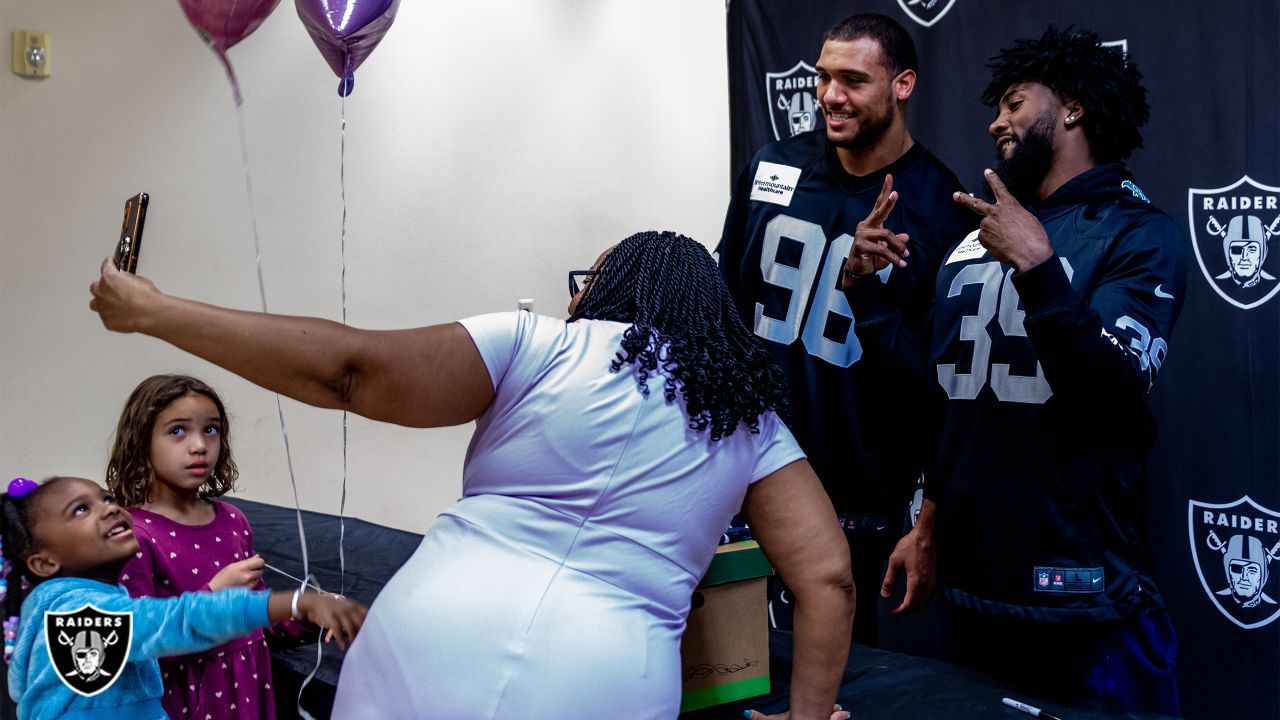 We didn't have a lot, but we did have family': Nate Hobbs, Tashawn Bower  spend quality time with North Las Vegas families during meal donation