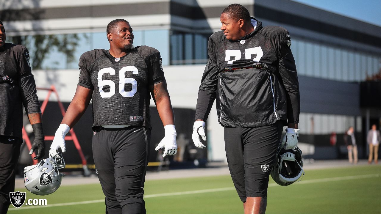 Las Vegas Raiders offensive tackle Trent Brown (77) warms up with a mask on  during a practice …