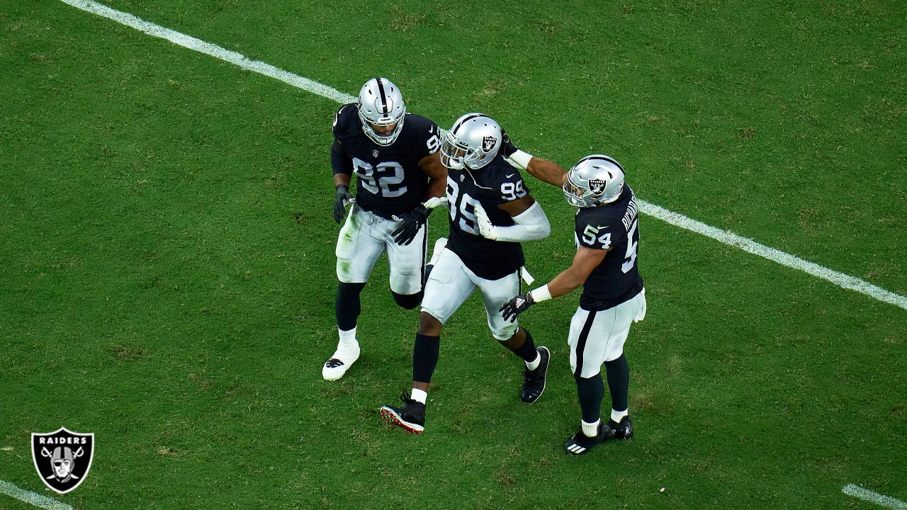 Raiders defensive end Clelin Ferrell (99) celebrates a sack with Raiders  defensive end Solomon …