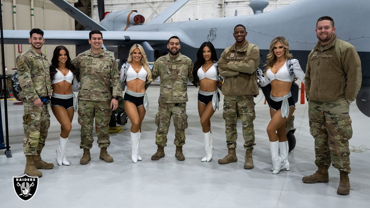 U.S. Military recruits are sworn in during halftime on Salute to Service  military appreciation day at an NFL football game between the Jacksonville  Jaguars and the Las Vegas Raiders, Sunday, Nov. 6